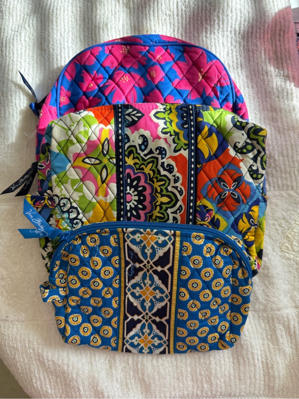 Vera Bradley 2 Large cosmetic bags and 1 medium cosmetic bag.